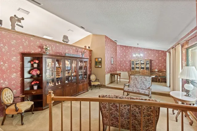 a very nice looking living room with a large window and furniture