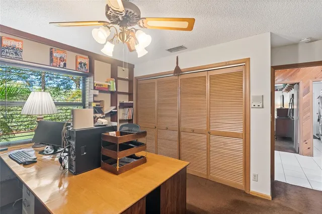 a room with table chairs and entryway