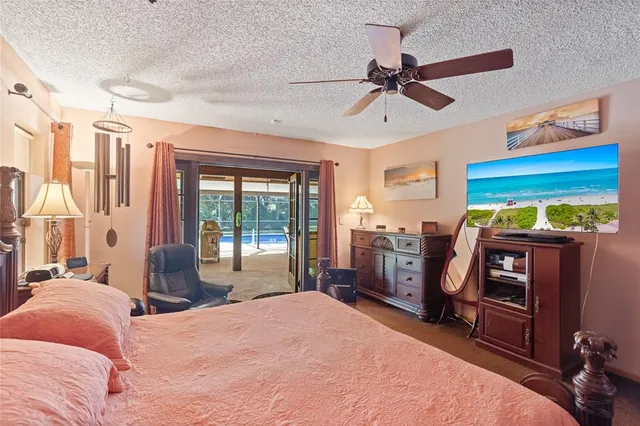 a bedroom with a bed and large mirror