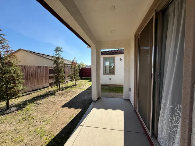 a view of an entryway with a hallway