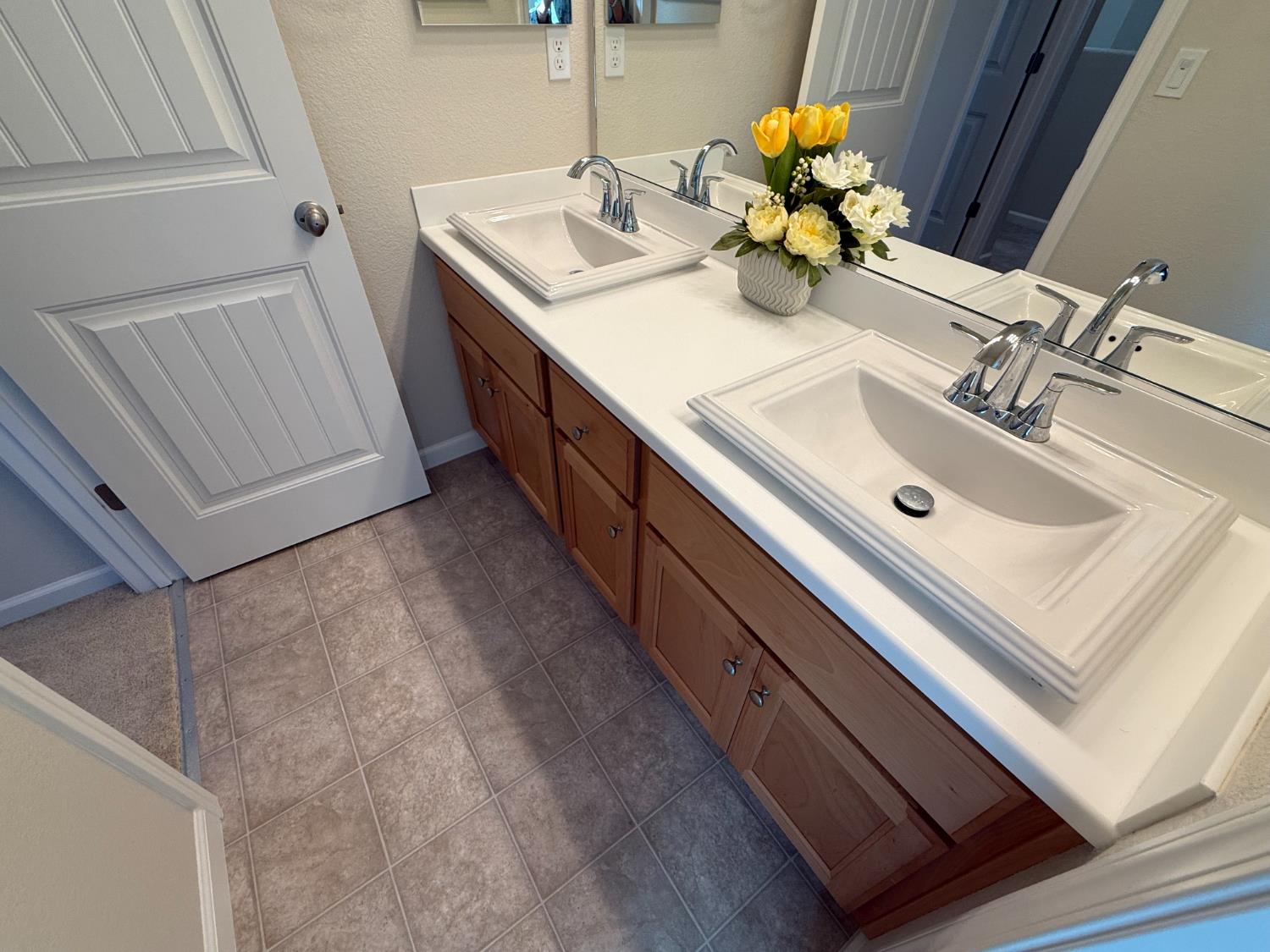 4344 Vanguard Drive Modesto, CA 95356 - Photo 39 of 48 a bathroom with a sink and a mirror