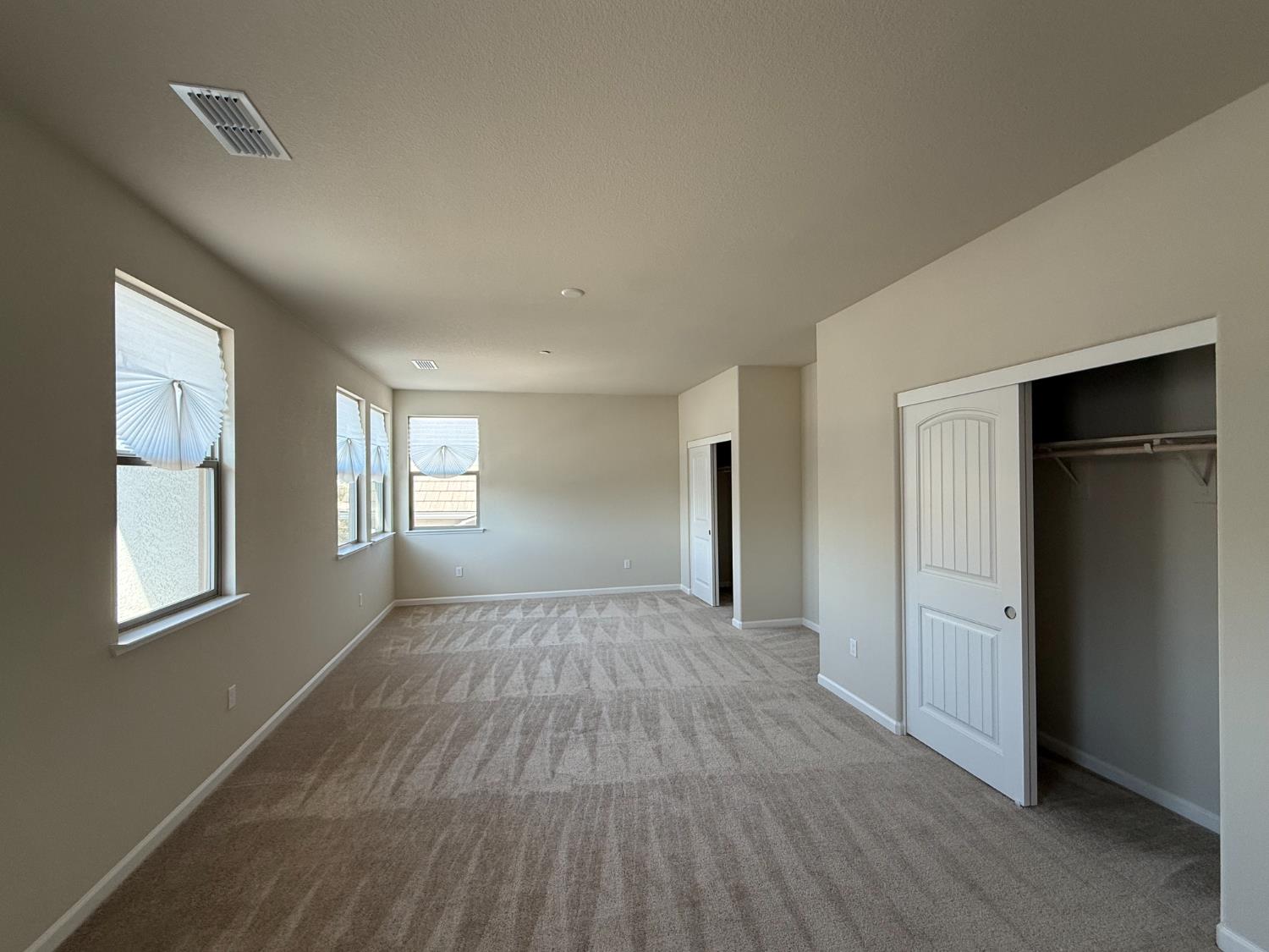 4344 Vanguard Drive Modesto, CA 95356 - Photo 47 of 48 an empty room with windows and closet