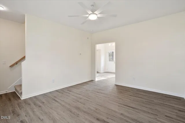 a kitchen with white cabinets stainless steel appliances and sink
