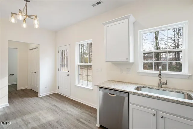 a white bath tub sitting next to a window