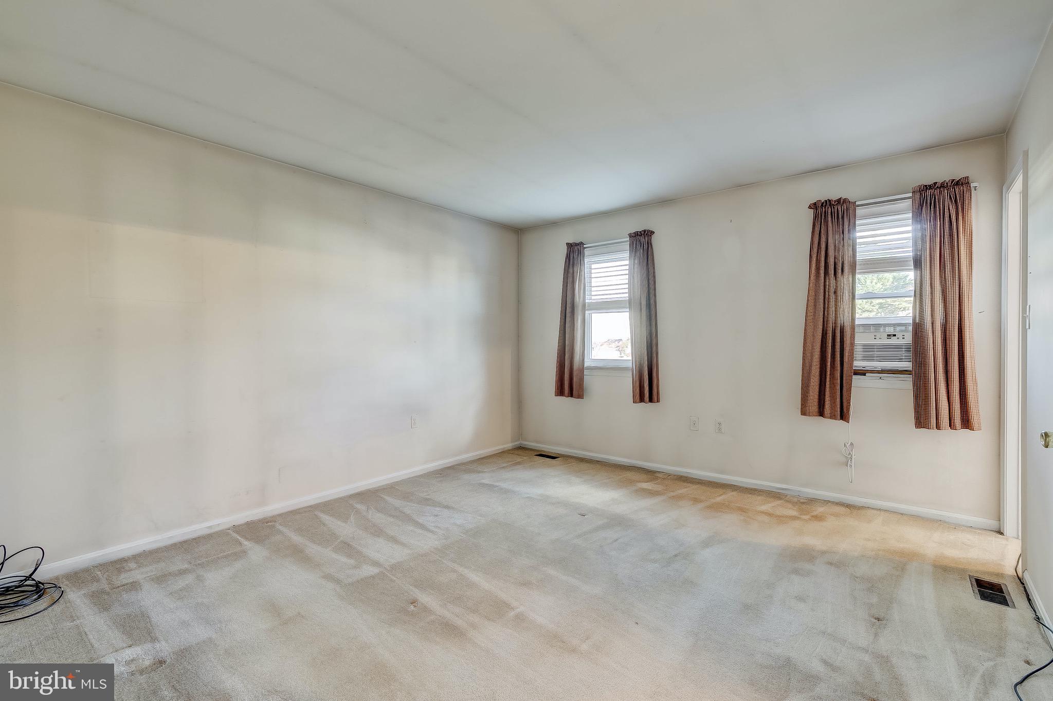 9326 Perglen Road Baltimore, MD 21236 - Photo 38 of 55 an empty room with windows