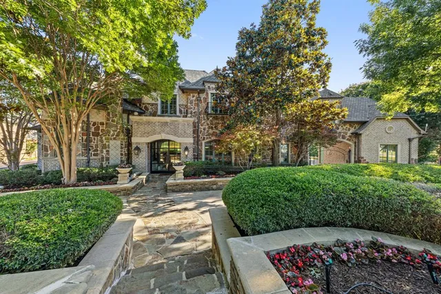a view of house with yard and outdoor seating