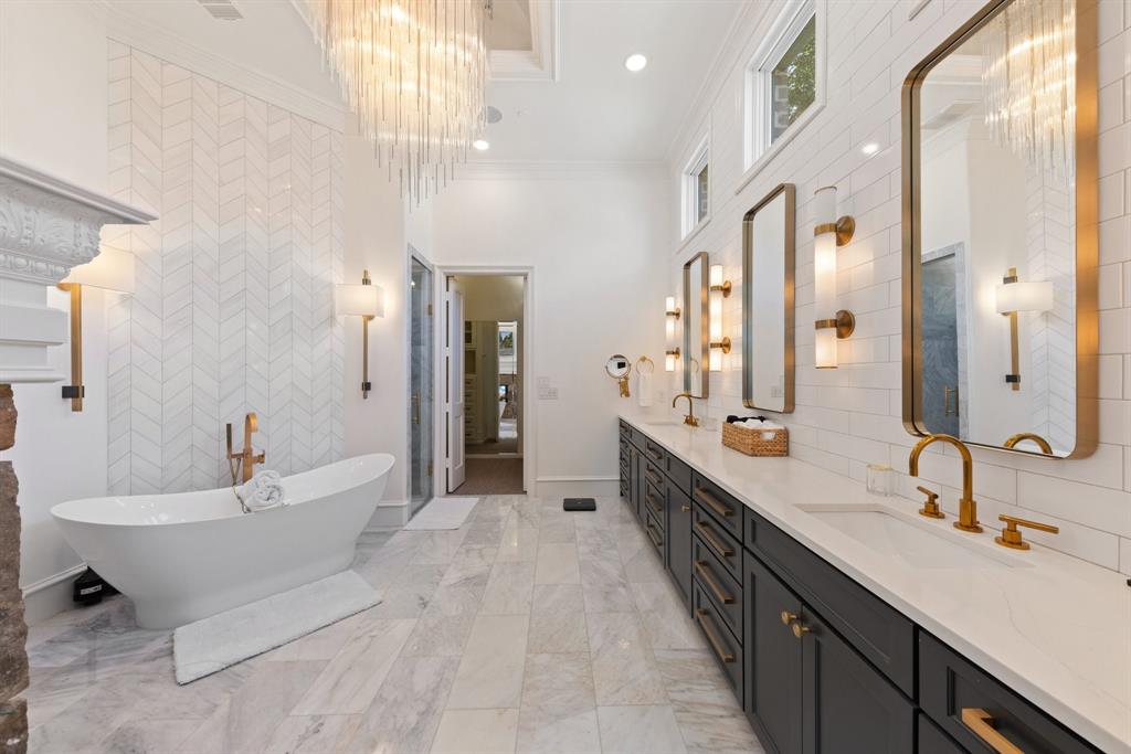 2 Terrabella Lane Heath, TX 75032 - Photo 15 of 40 a spacious bathroom with a double vanity sink a mirror and a bathtub
