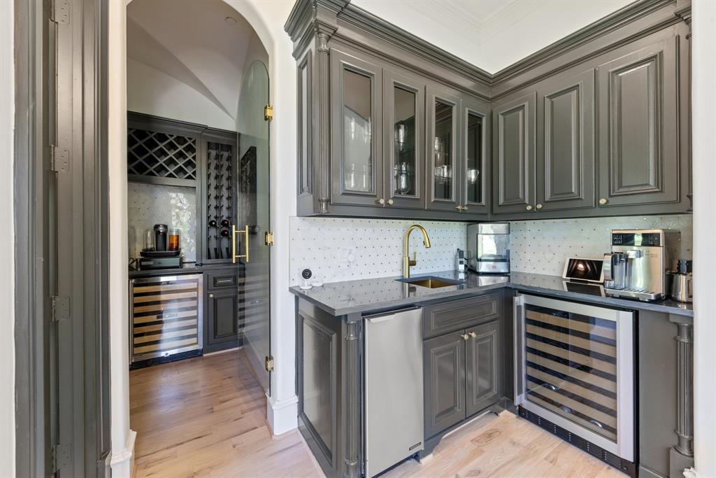 2 Terrabella Lane Heath, TX 75032 - Photo 21 of 40 a kitchen with granite countertop a sink and cabinets