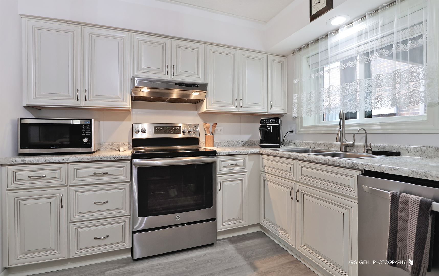 965 North Rohlwing Road, Unit 101A Addison, IL 60101 - Photo 6 of 14 a kitchen with white cabinets and white appliances