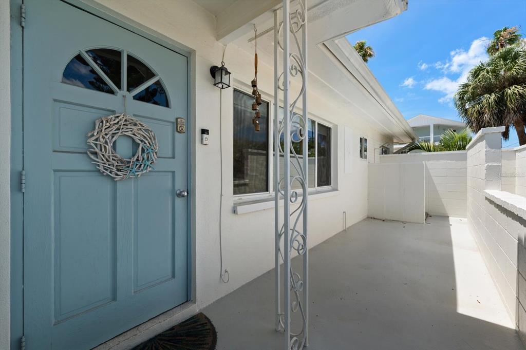 127 11th Avenue Indian Rocks Beach, FL 33785 - Photo 3 of 63 a view of a entryway door of the house