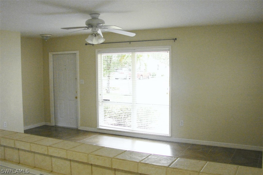 1443 Collins Road Fort Myers, FL 33919 - Photo 3 of 23 a view of an empty room with a window