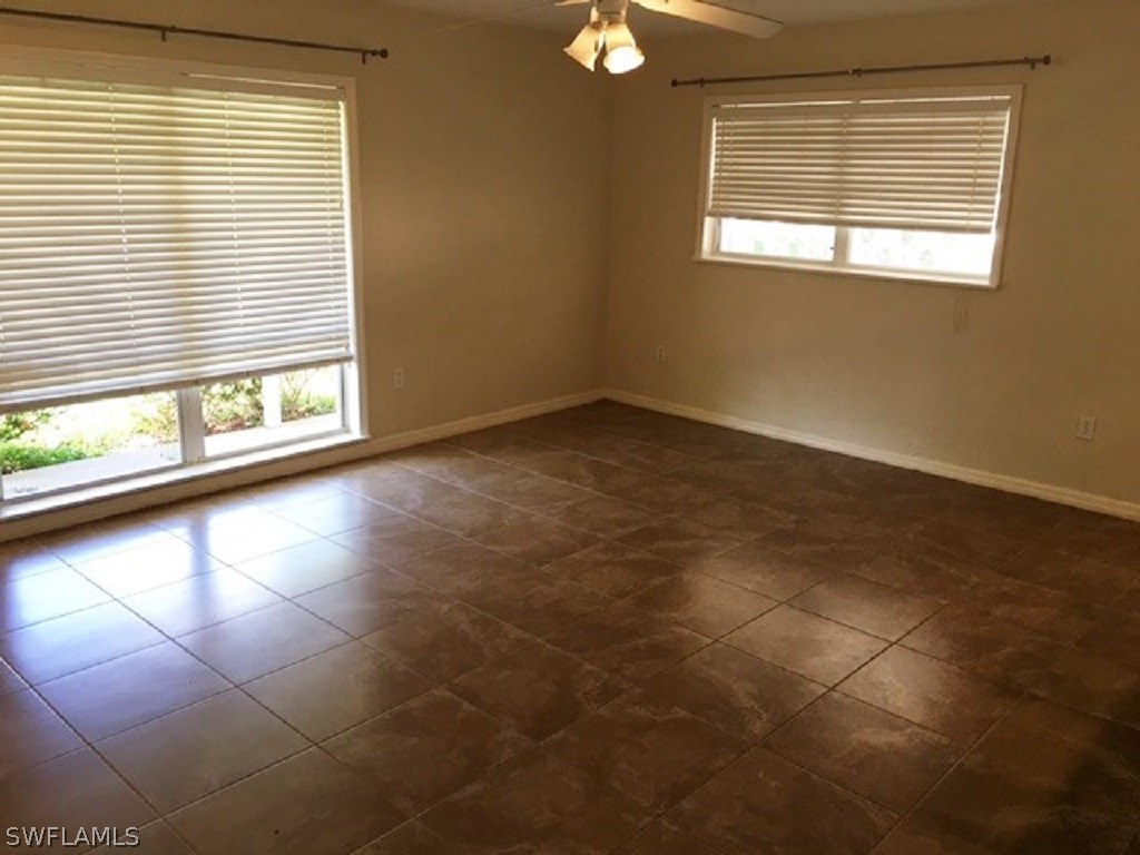 1443 Collins Road Fort Myers, FL 33919 - Photo 4 of 23 a view of a livingroom with a window