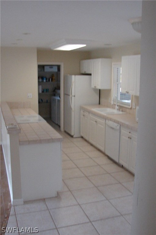 1443 Collins Road Fort Myers, FL 33919 - Photo 8 of 23 a large kitchen with a stove a refrigerator and a sink