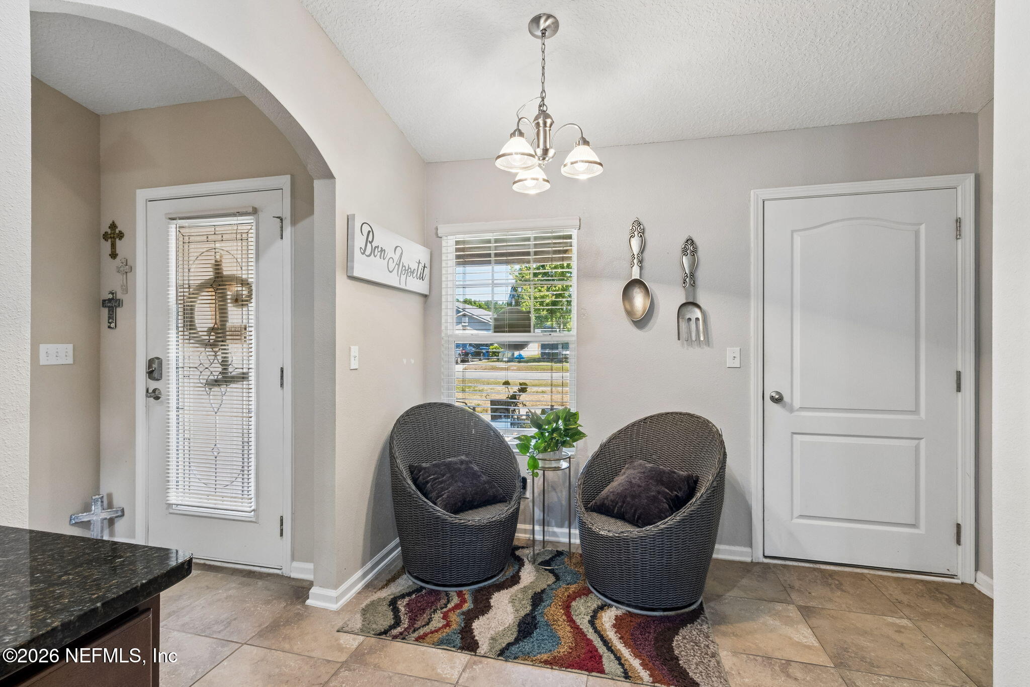 96034 Bass Lane Yulee, FL 32097 - Photo 23 of 50 a living room with furniture and a window