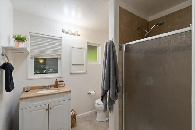 a bedroom with a bed and a mirror