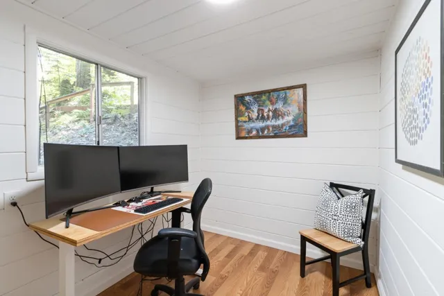 a view of balcony with wooden floor and outdoor seating