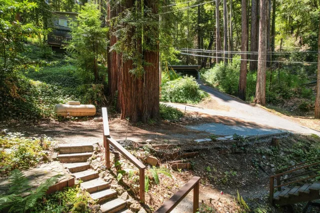 a front view of a house with outdoor seating