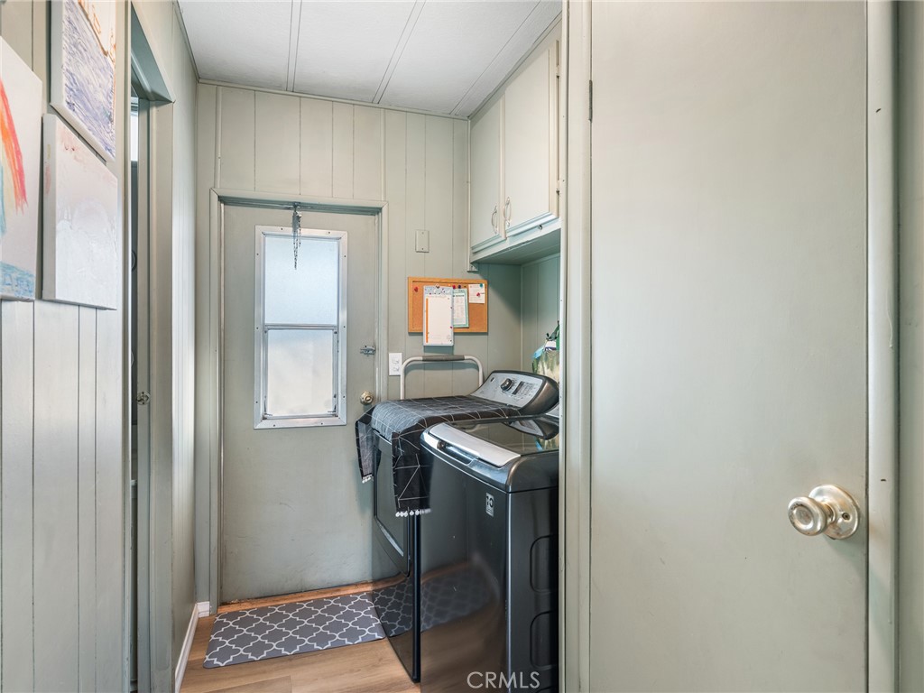 21922 Ottawa Road, Unit 8 Apple Valley, CA 92308 - Photo 15 of 31 a kitchen with a refrigerator and a stove