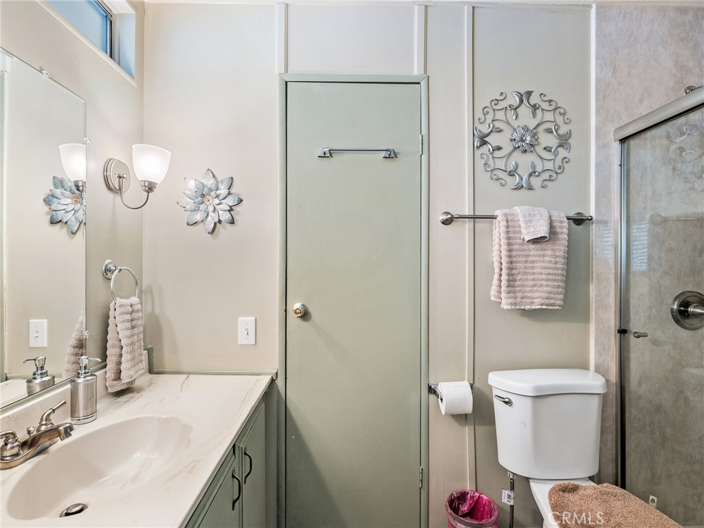 21922 Ottawa Road, Unit 8 Apple Valley, CA 92308 - Photo 17 of 31 a bathroom with a sink toilet and shower