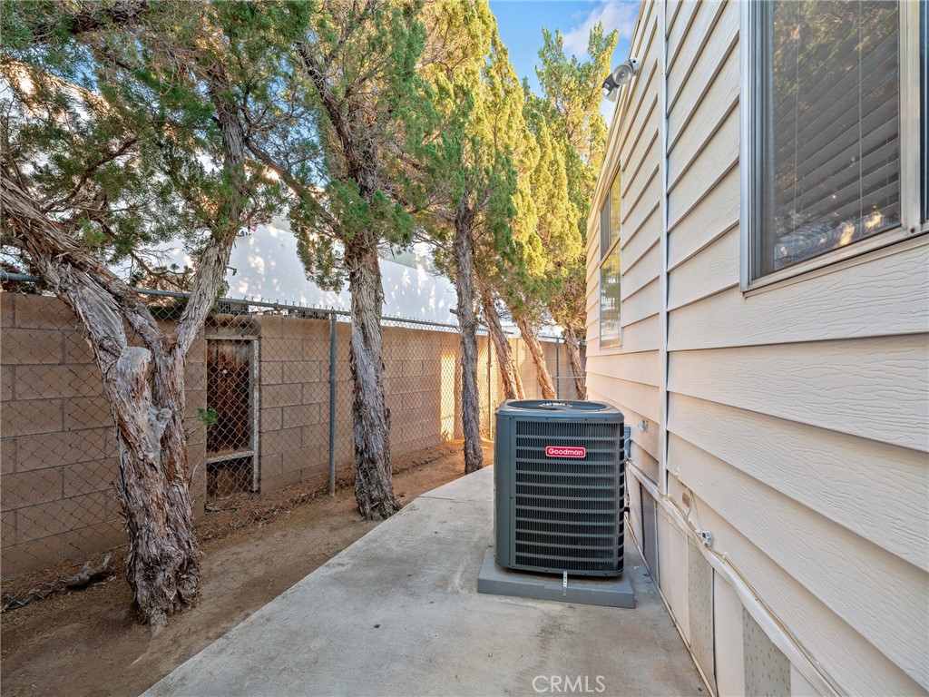 21922 Ottawa Road, Unit 8 Apple Valley, CA 92308 - Photo 27 of 31 a view of a pathway of a house