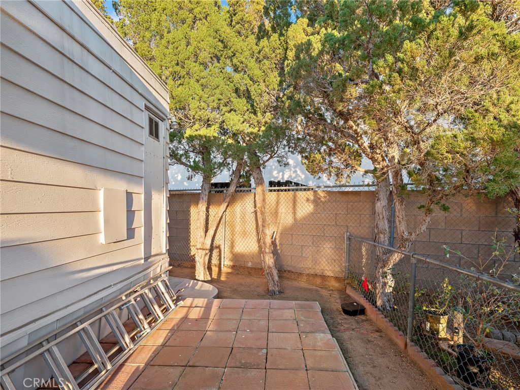 21922 Ottawa Road, Unit 8 Apple Valley, CA 92308 - Photo 28 of 31 a view of a pathway with a backyard