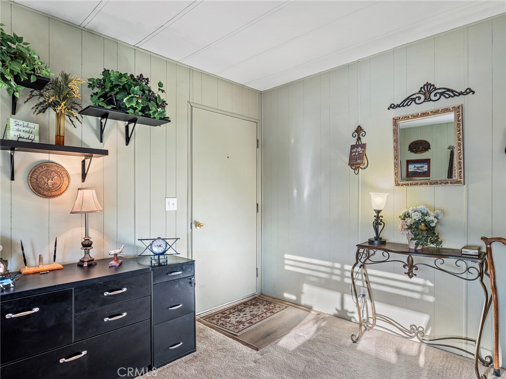 21922 Ottawa Road, Unit 8 Apple Valley, CA 92308 - Photo 3 of 31 a living room with furniture and a potted plant