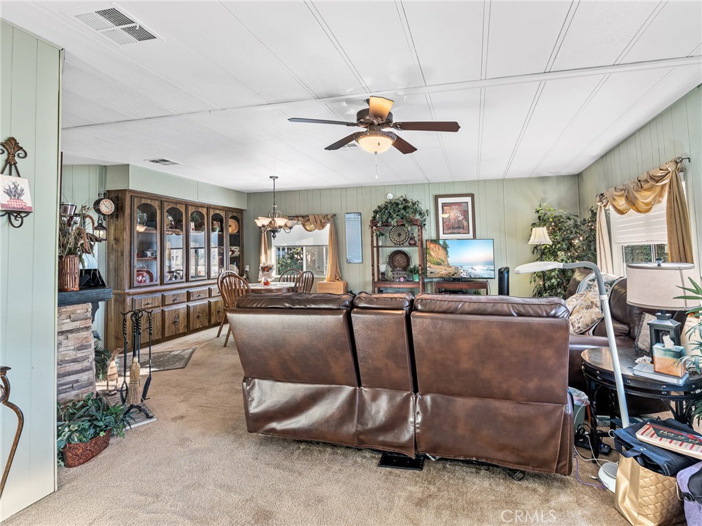 21922 Ottawa Road, Unit 8 Apple Valley, CA 92308 - Photo 4 of 31 a living room with furniture and a window