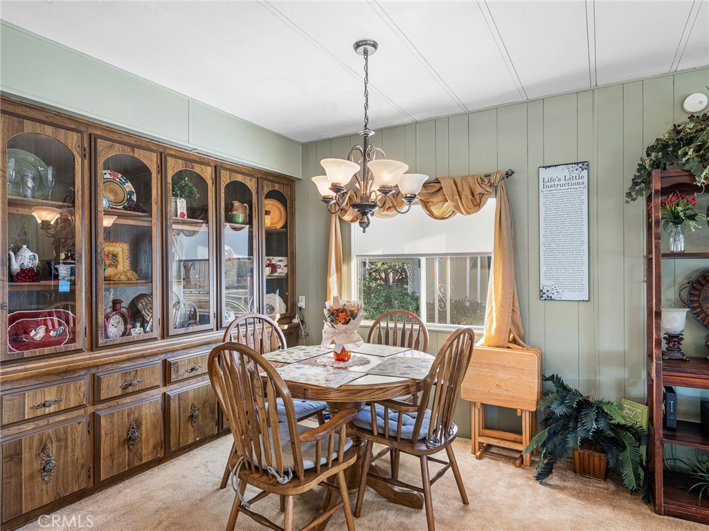 21922 Ottawa Road, Unit 8 Apple Valley, CA 92308 - Photo 5 of 31 a view of a dining room with furniture window and outside view