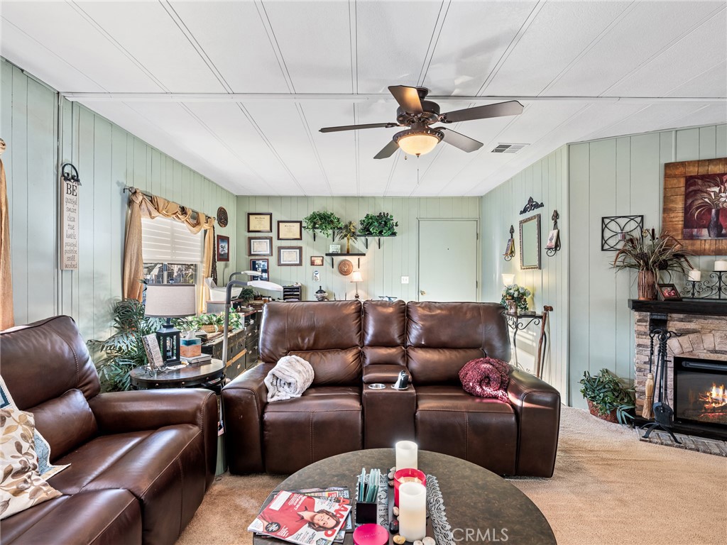 21922 Ottawa Road, Unit 8 Apple Valley, CA 92308 - Photo 7 of 31 a living room with furniture and a ceiling fan