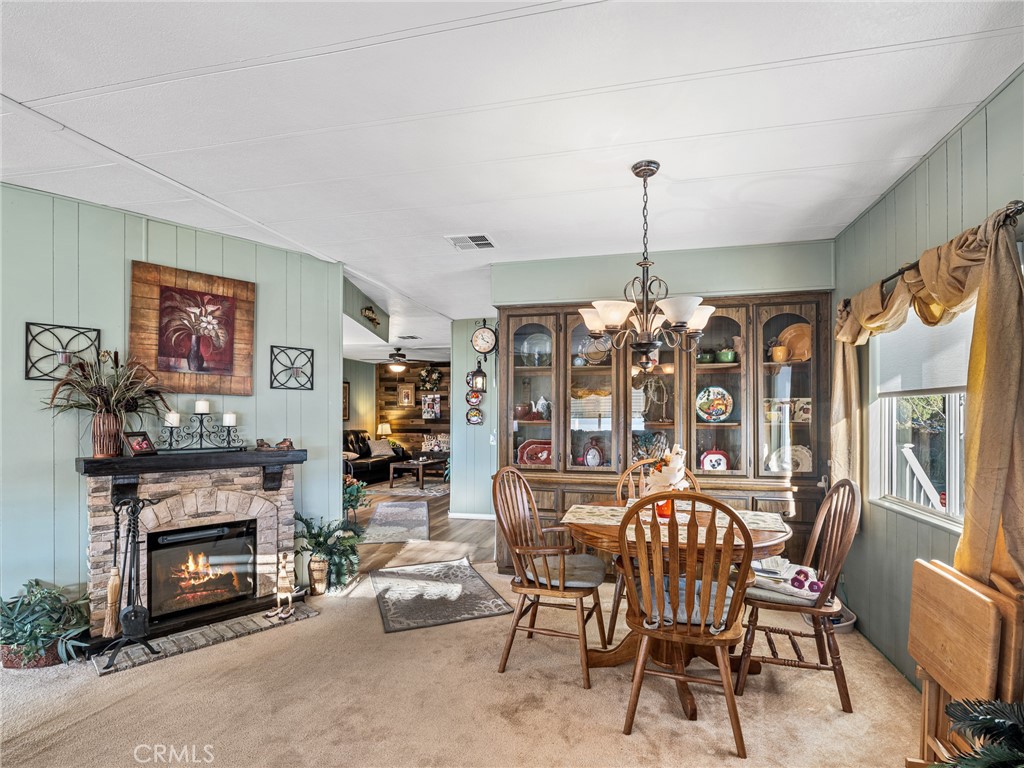 21922 Ottawa Road, Unit 8 Apple Valley, CA 92308 - Photo 8 of 31 a view of a livingroom with furniture window and fireplace
