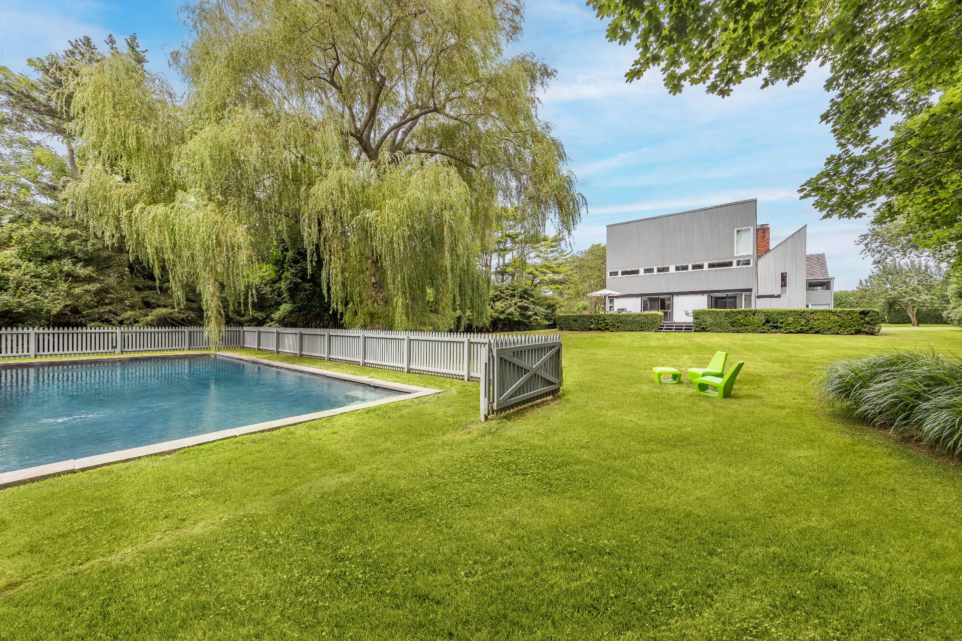 a view of a swimming pool with a yard
