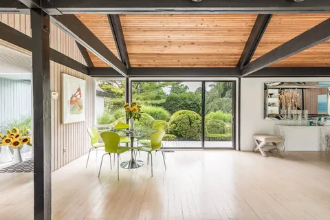 a view of a porch with wooden floor