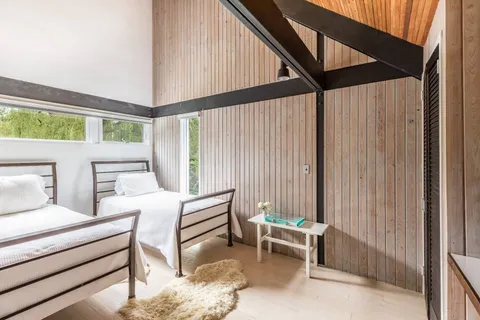 a bedroom with furniture and a window