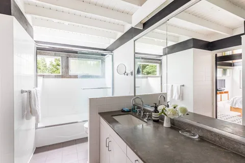 a kitchen with a refrigerator and a sink