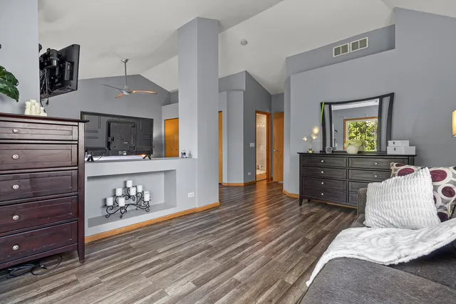 a living room with furniture and flat screen tv