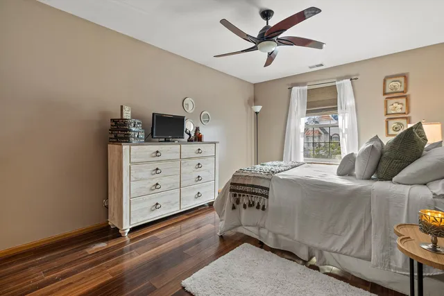 a bedroom with a bed and a dresser