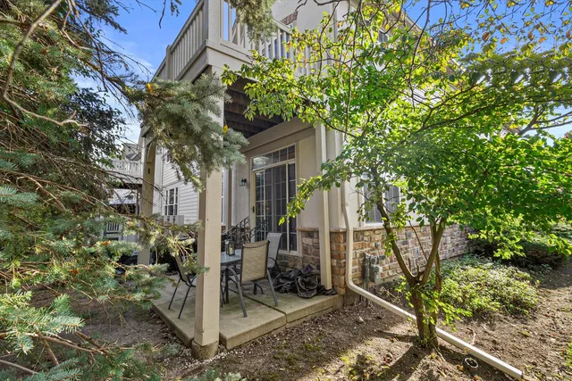 a view of a house with a tree