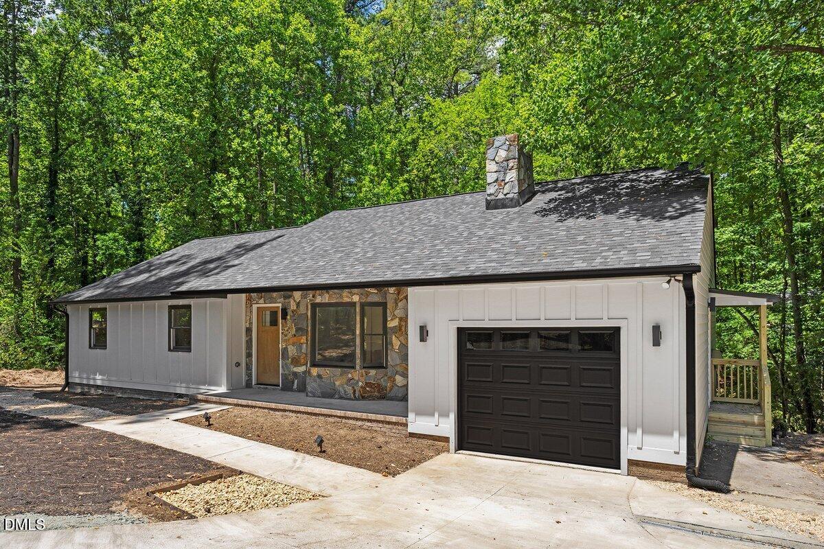 1712 Rosedale Avenue Durham, NC 27707 - Photo 2 of 39 a front view of a house with a yard and garage