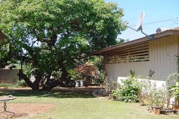 4873 Alii Road Hanapepe, HI 96716 - Photo 10 of 13 a view of a house with a yard