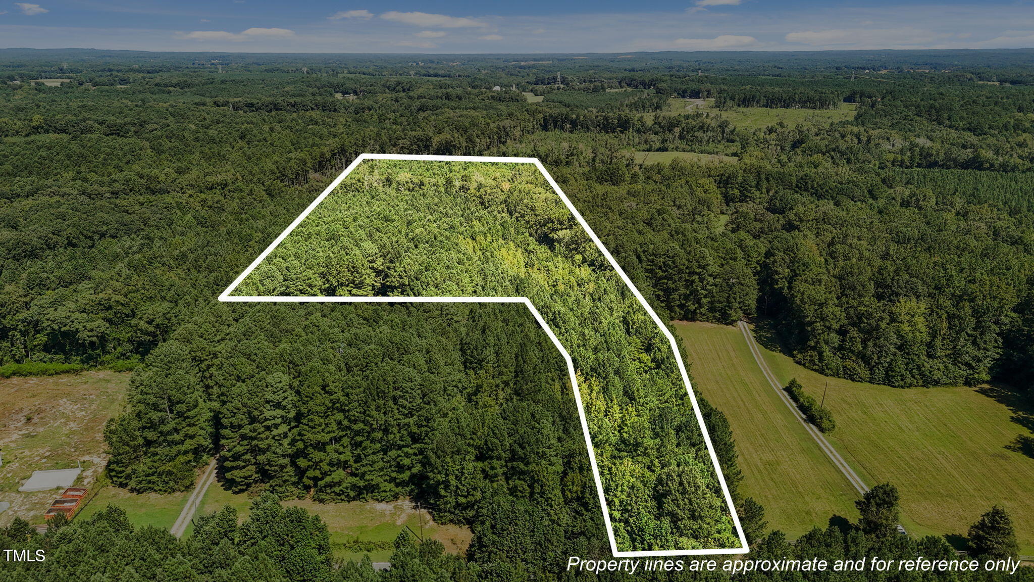 a view of a yard with a swimming pool