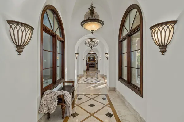 a kitchen with stainless steel appliances granite countertop a sink a stove and a wooden floors