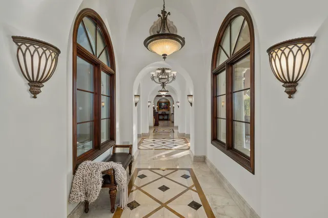 a kitchen with stainless steel appliances granite countertop a sink a stove and a wooden floors