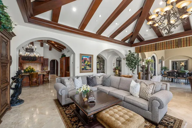 a view of a hallway with wooden floor and furniture
