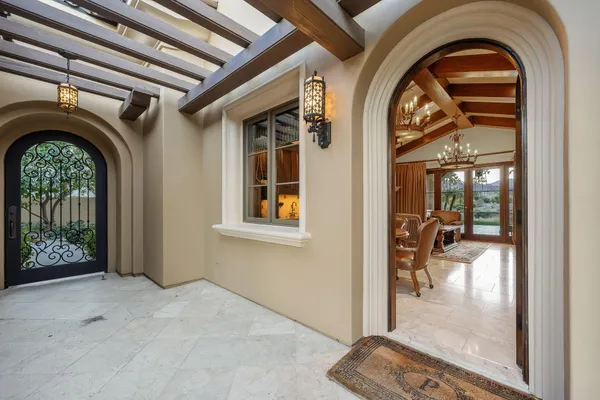 a living room with furniture and a floor to ceiling window