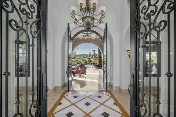 a view of a lake with couches chairs
