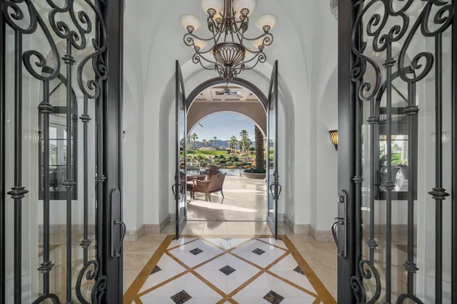 a view of a lake with couches chairs