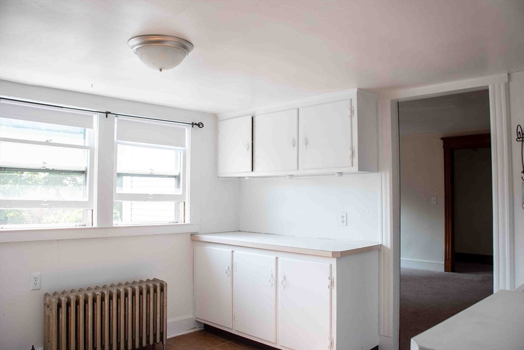 39 Sugarloaf Street, Unit 2 Deerfield, MA 01373 - Photo 2 of 7 a room with a window and a kitchen view