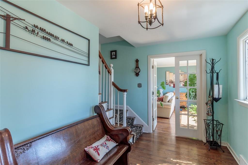 20 Alexander Place Pittsburgh, PA 15243 - Photo 2 of 25 a view of a hallway with wooden floor and stairs