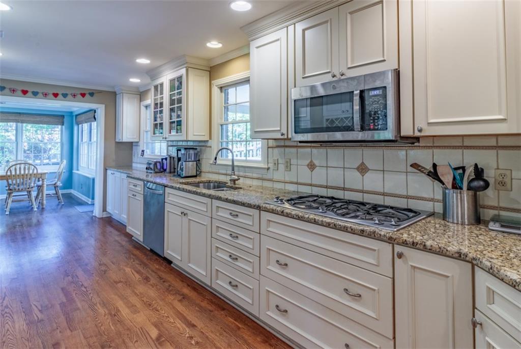 20 Alexander Place Pittsburgh, PA 15243 - Photo 7 of 25 a kitchen with stainless steel appliances granite countertop a stove a sink and white cabinets
