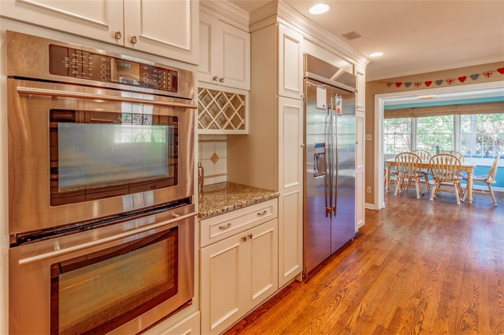20 Alexander Place Pittsburgh, PA 15243 - Photo 8 of 25 a kitchen with granite countertop cabinets stainless steel appliances and wooden floor